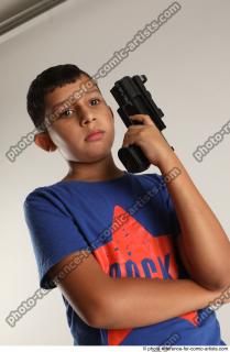 TIMBO STANDING POSE WITH GUN